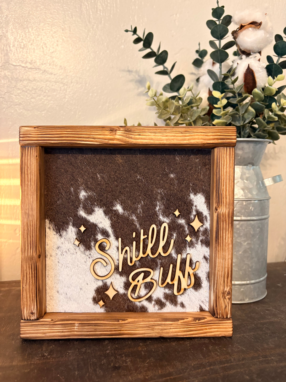 Shit'll Buff Cowhide Framed Sign