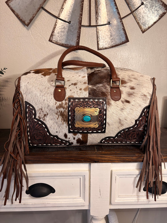 Brown and White Cowhide Duffle Bag with Tooled Leather