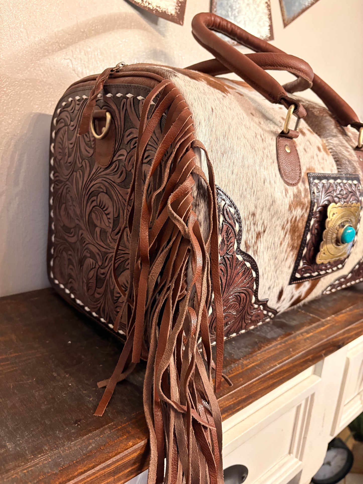 Brown and White Cowhide Duffle Bag with Tooled Leather