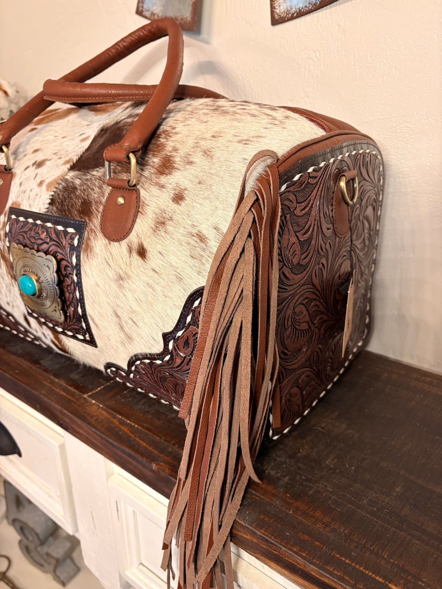 Brown and White Cowhide Duffle Bag with Tooled Leather