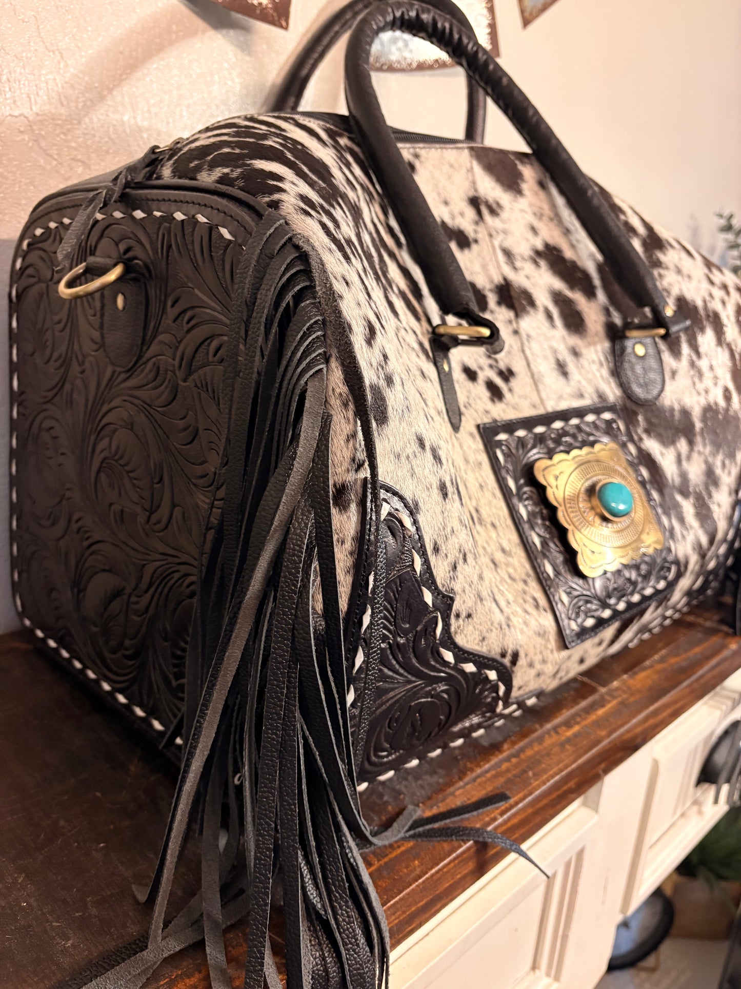 Black and White Cowhide Duffle Bag with Tooled Leather
