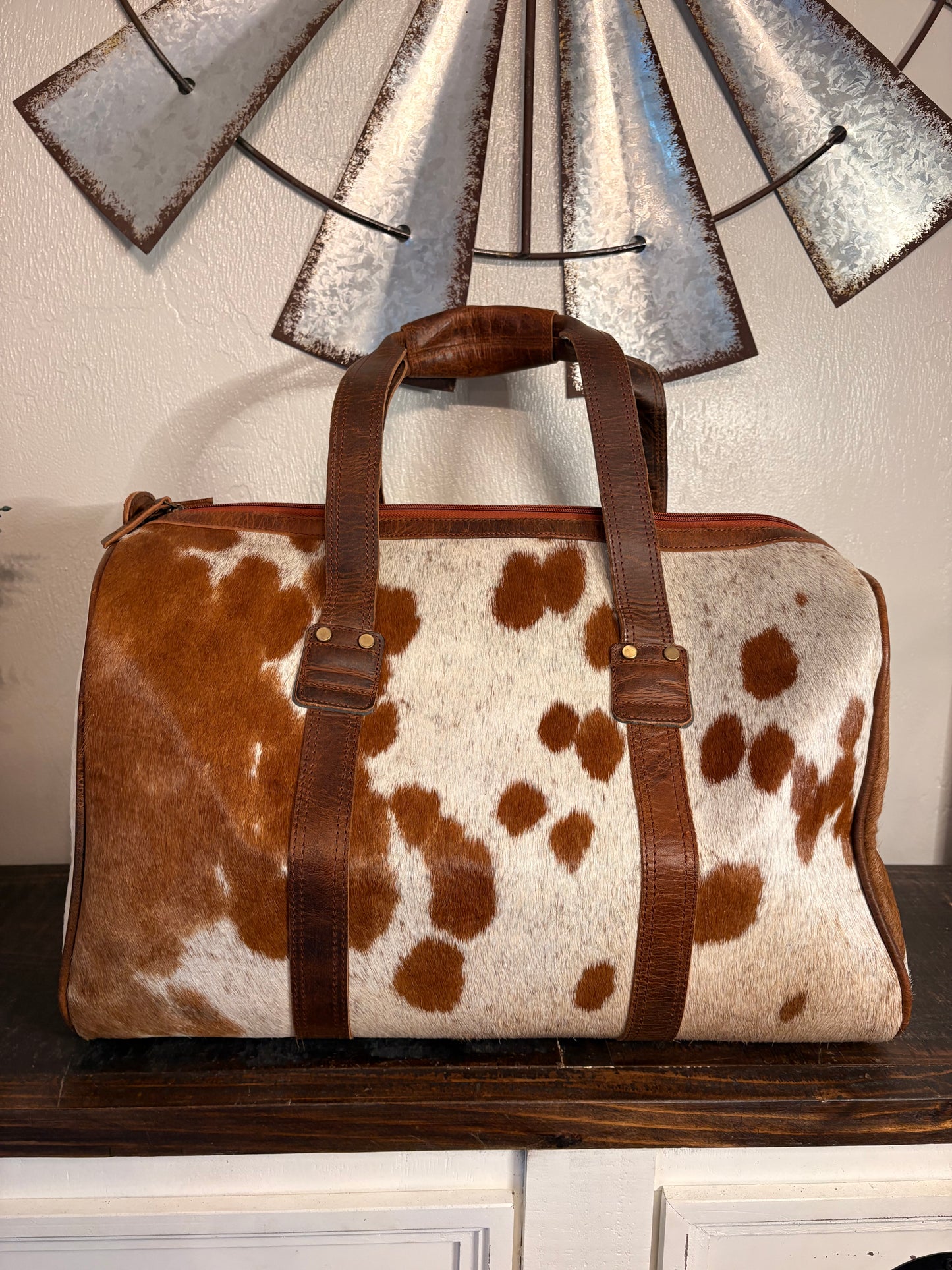 Brown and White Cowhide Duffle Bag
