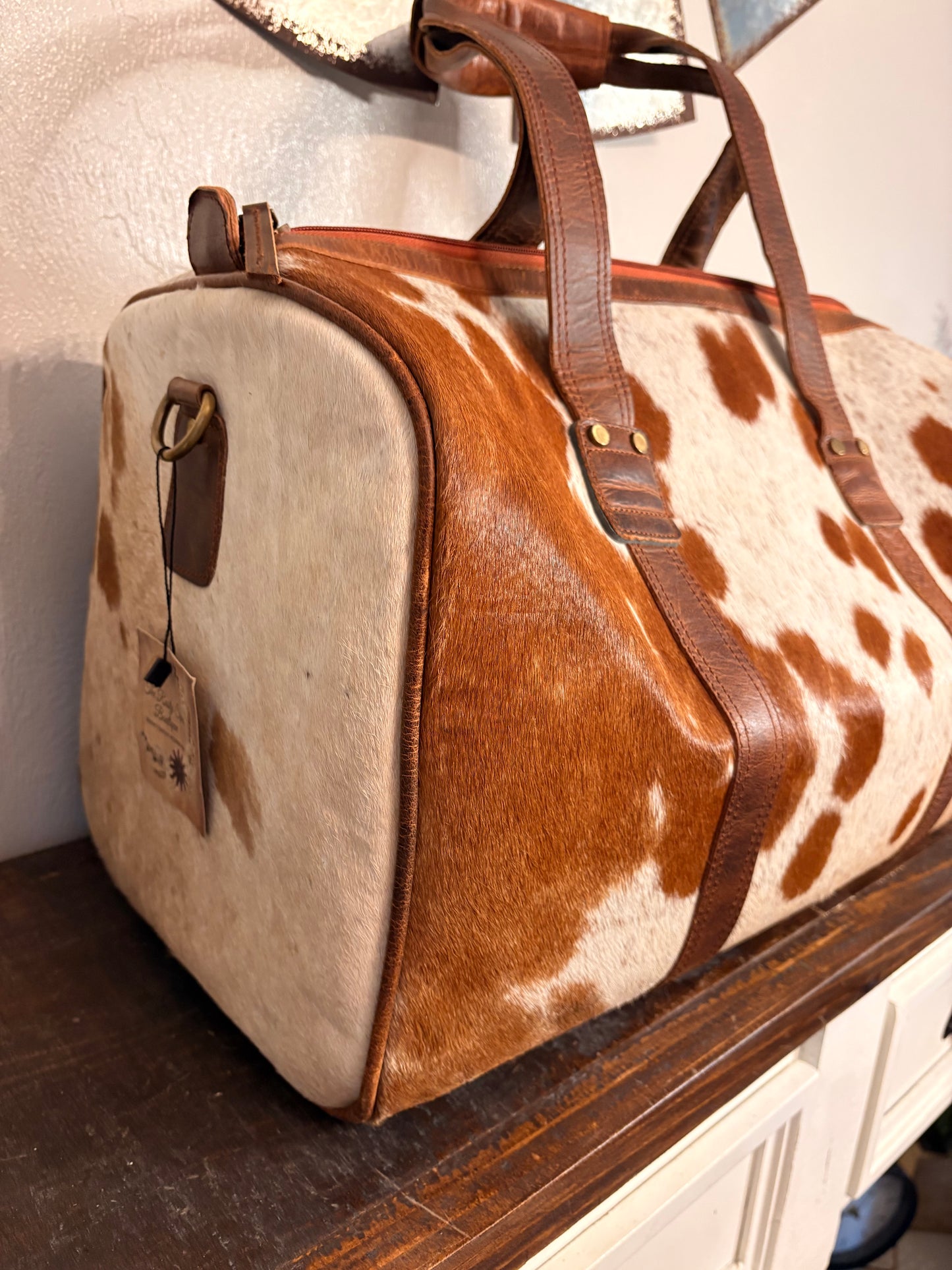 Brown and White Cowhide Duffle Bag