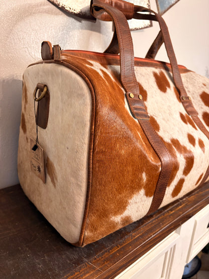 Brown and White Cowhide Duffle Bag