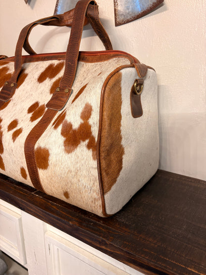 Brown and White Cowhide Duffle Bag