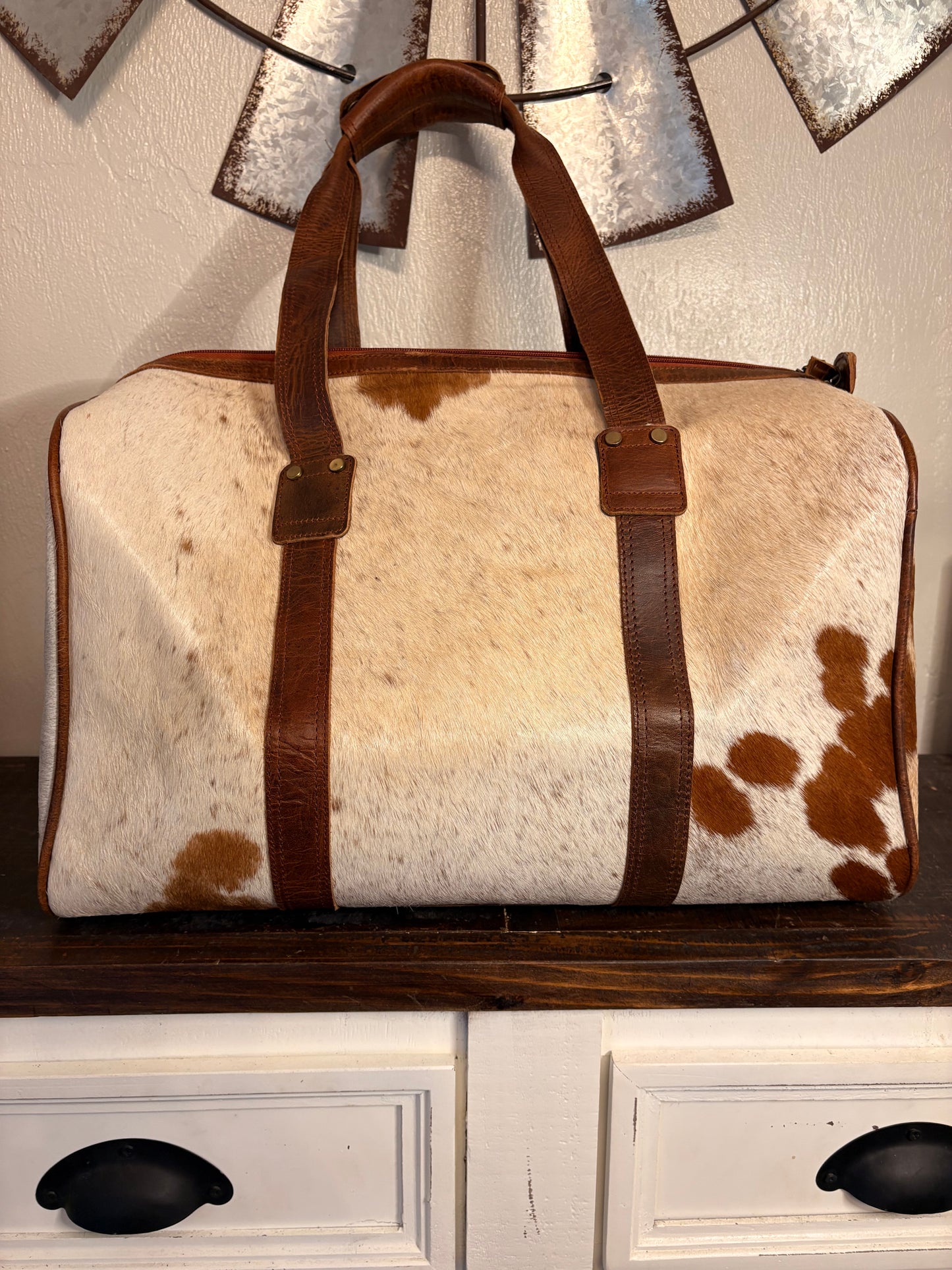 Brown and White Cowhide Duffle Bag
